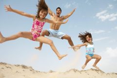 father-and-daughters-jumping-2151902-scaled