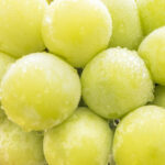 Qual é a origem da uva sem caroço?